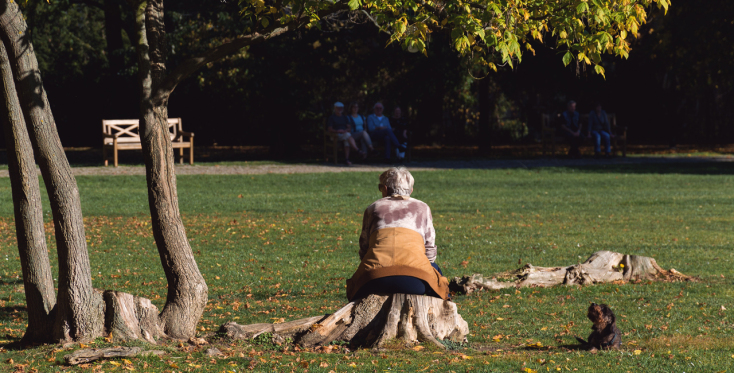 old-woman-with-dog-sitting-in-the-park.jpg