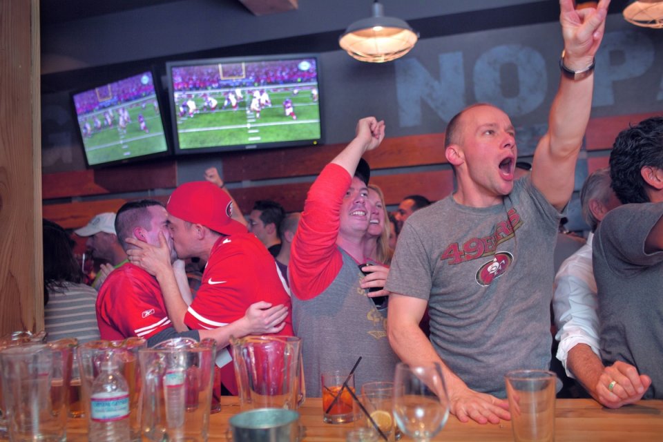 Deanne Fitzmaurice (American, born 1957). Touchdown Kiss, 2013. Color photograph, 9½ x 14½ in. (24.1 x 36.8 cm). Collection of Deanne Fitzmaurice Deanne Fitzmaurice (American, born 1957). Touchdown Kiss, 2013. Color photograph