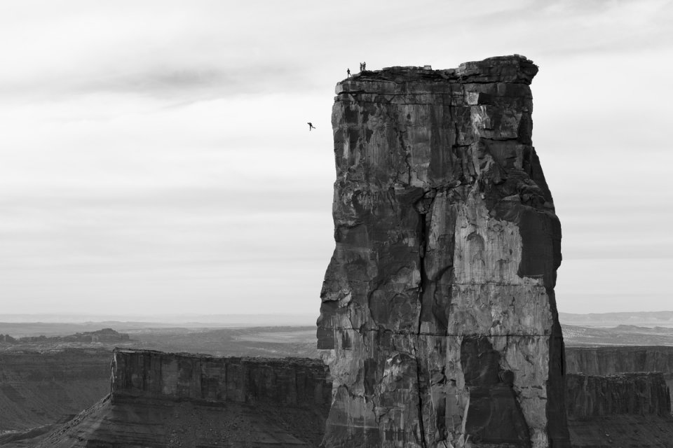 Krystle Wright (Australian, born 1987). Freefall, Michael Tomchek leaps off Castleton Tower (400ft) as fellow BASE jumpers look on, Castle Valley, Utah, 2010, printed 2016. Inkjet print, 13 1/4 x 20 in. (33.9 x 50.8 cm). Collection of Krystle Wright Krystle Wright (Australian, born 1987). Freefall, Michael Tomchek leaps off Cast